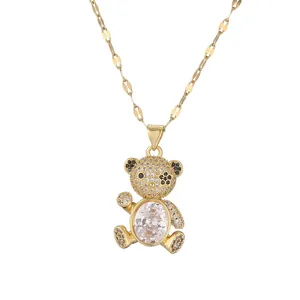 Golden necklace featuring a cute bear pendant set with sparkling clear zircons