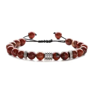 Adjustable woven bracelet with natural red jasper beads and textured silver metal spacers