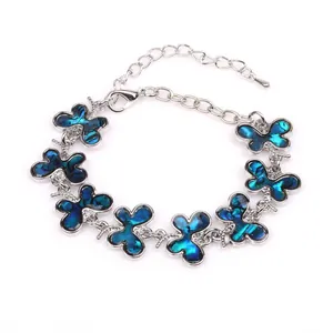 Silver bracelet with butterfly charms and deep blue abalone shell inlay