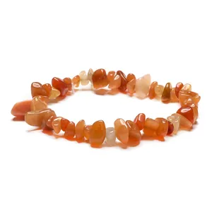 Handmade elastic bracelet featuring polished irregular red agate crystal stones