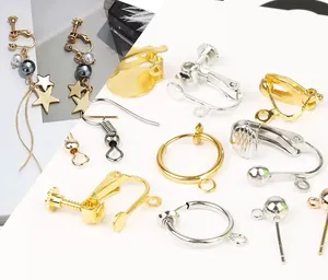 Macro detail of various gold and silver spiral clip-on earring converters for DIY jewelry