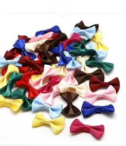 Detailed view of colorful satin ribbon bows in various vibrant shades for DIY hair crafts