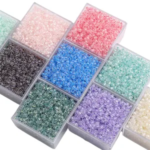 Close-up of colorful 4mm faceted glass beads in storage boxes for DIY jewelry making
