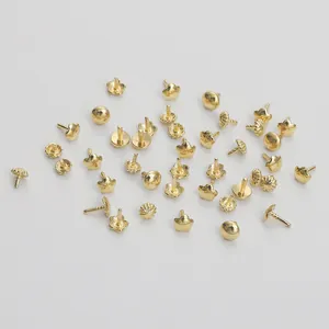 Macro view of assorted 14K gold plated flower and star shaped jewelry making pendants