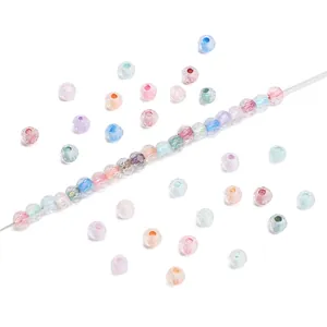 Close-up of 4mm faceted glass beads with chameleon luster for DIY jewelry making
