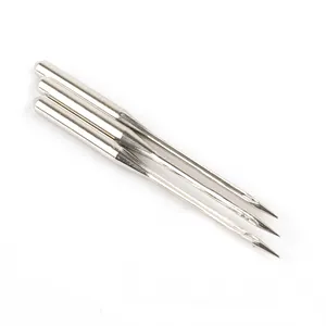 Close-up of three silver stainless steel sewing machine needles for DIY craft projects
