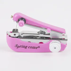 Pink portable mini manual sewing machine for DIY clothing repairs and sewing crafts