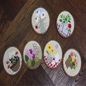 Detailed collection of six vintage-style floral embroidery hoops with wood-grain frames