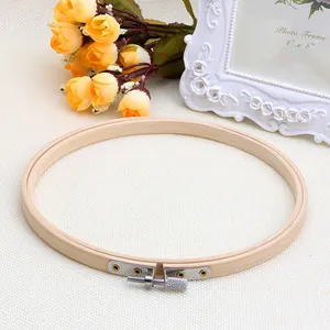 Detail of round bamboo embroidery hoop with a silver adjustable metal screw mechanism