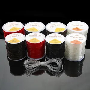 Elastic crystal string for jewelry DIY, 0.8mm and 1.0mm rolls on black background