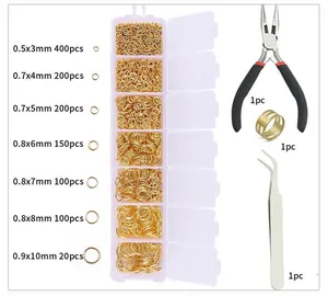 Detail view of 7 sizes of golden jump rings in a plastic box with jewelry DIY tools set