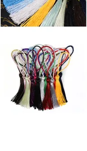 Close-up of colorful polyester silk tassels with loop for DIY bookmarks and crafts
