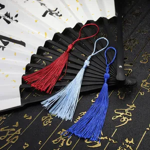 Chinese silk tassels in red and blue for fans and DIY jewelry crafts on white fan