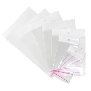 Sachets d'emballage OPP transparents avec trous de suspension et bandes violettes