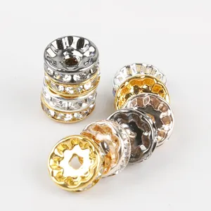 Perline distanziatrici piatte con cristalli bianchi in oro, argento e rame metallico