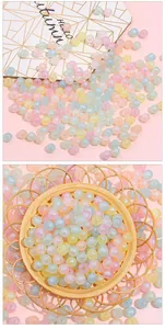 Macro view of colorful acrylic mermaid round beads with iridescent finish for DIY jewelry