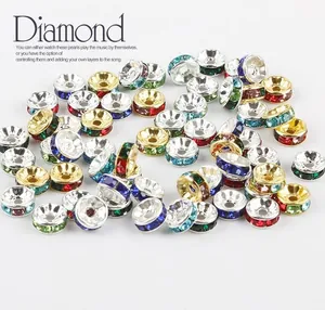 Close-up of colorful rhinestone spacer beads in gold and silver metal for DIY jewelry