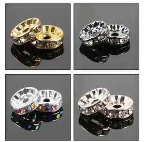 Macro detail of rondelle spacer beads in gold and silver with sparkling rhinestones