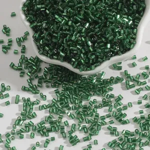 2mm emerald green glass bugle beads for DIY jewelry and sewing on white background