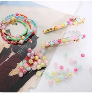 Macro shot of macaron color acrylic beads and resin hair clips in various pastel tones