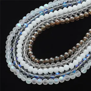 Mix of matte, glossy and iridescent crystal beads for DIY jewelry making on black background
