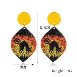 Halloween black cat acrylic earrings with orange glitter details and size measurements