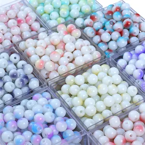 DIY round glass beads set with white and multi-color gradient paint in a plastic box