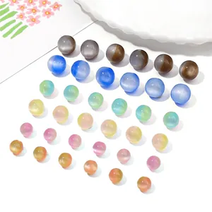 Detailed view of colorful resin cat eye beads for DIY jewelry making in various shades