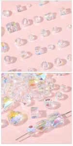 Macro shot of iridescent Aurora heart and butterfly glass crystal beads for DIY jewelry