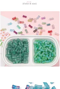 Detail macro of colorful marble texture bamboo shaped resin beads for jewelry making