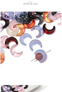Macro shot of colorful crescent moon glass beads with pre-drilled holes for DIY jewelry