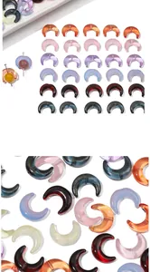 Macro detail of multi-colored crescent moon glass beads with shimmer for DIY jewelry