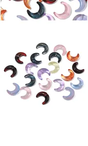 Macro detail of colorful crescent moon glass beads with pre-drilled holes for DIY jewelry