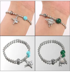 Detailed view of y2k style beaded heart and star bracelets with sparkling alloy charms
