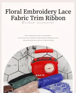 Macro detail of multi-colored floral embroidery lace trim ribbon with fringe edge