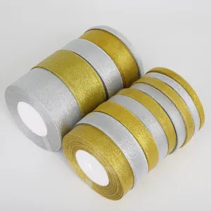 Glittery gold and silver metallic ribbon rolls for DIY gift wrapping and crafts