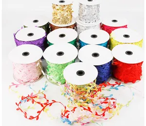 Macro view of colorful polyester leaf ribbon rolls for DIY crafts and gift wrapping