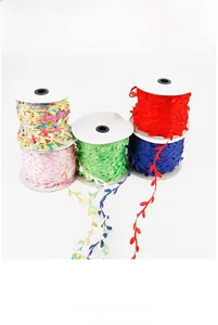 Macro shot of 10m colorful polyester leaf trim ribbons on spools for DIY sewing