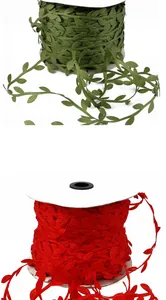Macro detail of 10m polyester leaf trim ribbon in red and green for DIY decor