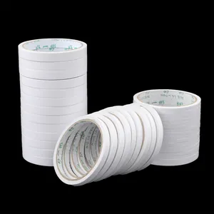 Multiple rolls of white high-viscosity double-sided tape for DIY jewelry making
