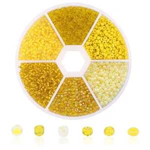 6-grid DIY seed bead set with various yellow and white beads in a round storage box