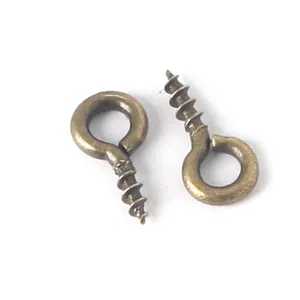 Antique bronze eye pins for DIY jewelry making with threaded screw hooks on white background