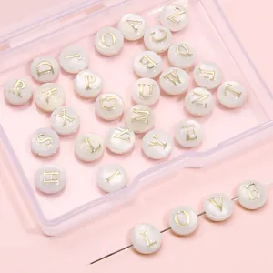 Natural shell alphabet beads with gold lettering for handmade jewelry and DIY bracelets