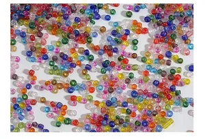Close-up of colorful glass seed beads in various vibrant hues for DIY jewelry crafts
