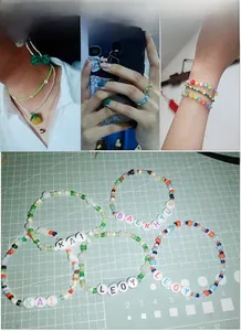 Macro view of colorful 2/3/4mm glass bead jewelry sets with custom alphabet lettering