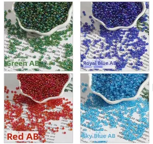 Macro detail of mixed color glass seed beads with AB iridescent finish in display trays