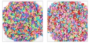 Close-up of colorful butterfly and LOVE heart polymer clay slices for DIY crafts