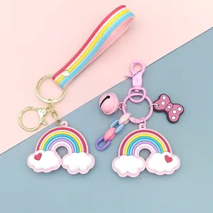 Macro shot of colorful rainbow keychains with soft silicone charms and pink polka dot bows