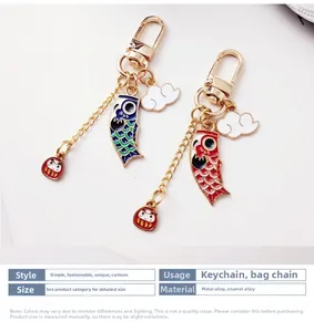 Detail of Japanese koi fish keychains with colorful enamel finish and golden lobster clasps