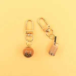 Detailed top view of miniature bubble tea cup and resin pearl ball keychains